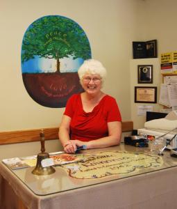 Carol Schuster at Welcome Center Desk