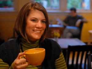 Rachel Held Evans holding a yellow coffee mug